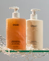 ouai detox shampoo and thick hair conditioner jumbo size bottle on a neutral background