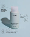 OUAI anti-dandruff shampoo bottle with text on a light blue background