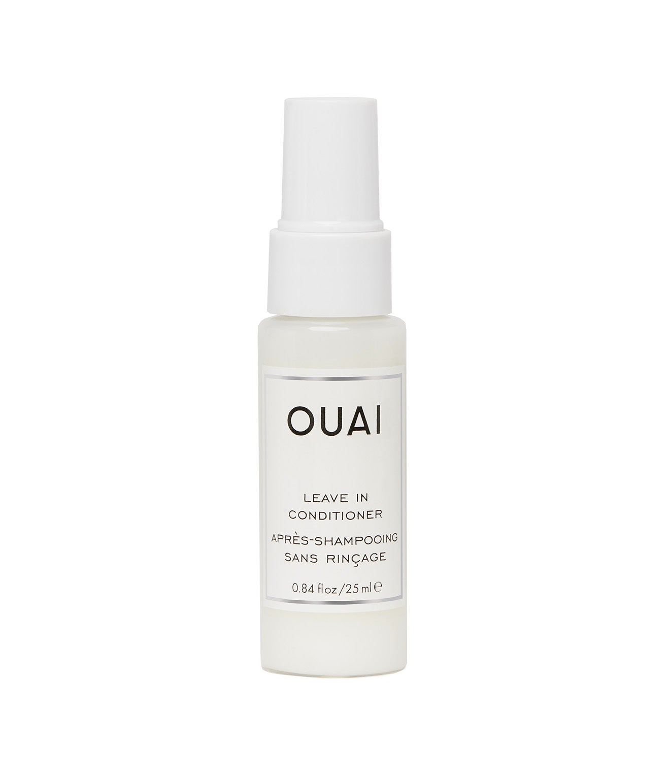 A white spray bottle labeled 'OUAI LEAVE IN CONDITIONER' with a clear measurement scale on the front.