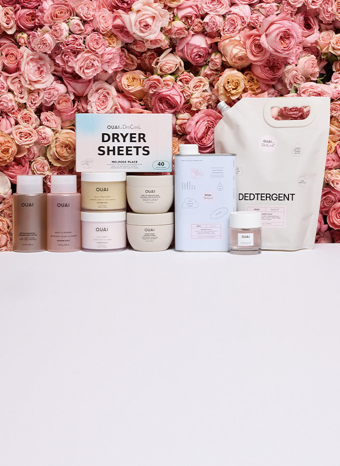 Cleaning products including dryer sheets, detergent, and other items against a pink floral background.