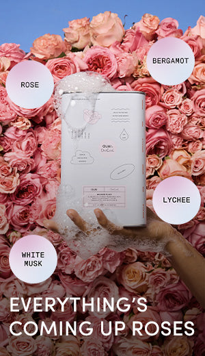 Product packaging held over a bed of pink roses with text labels on a blue background