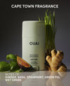 OUAI deodorant with botanical elements on a dark background, featuring Cape Town Fragrance notes.