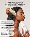 A woman with wet, styled hair holds a white OUAI hair care bottle while using a beige comb, with promotional text on a light gray background.