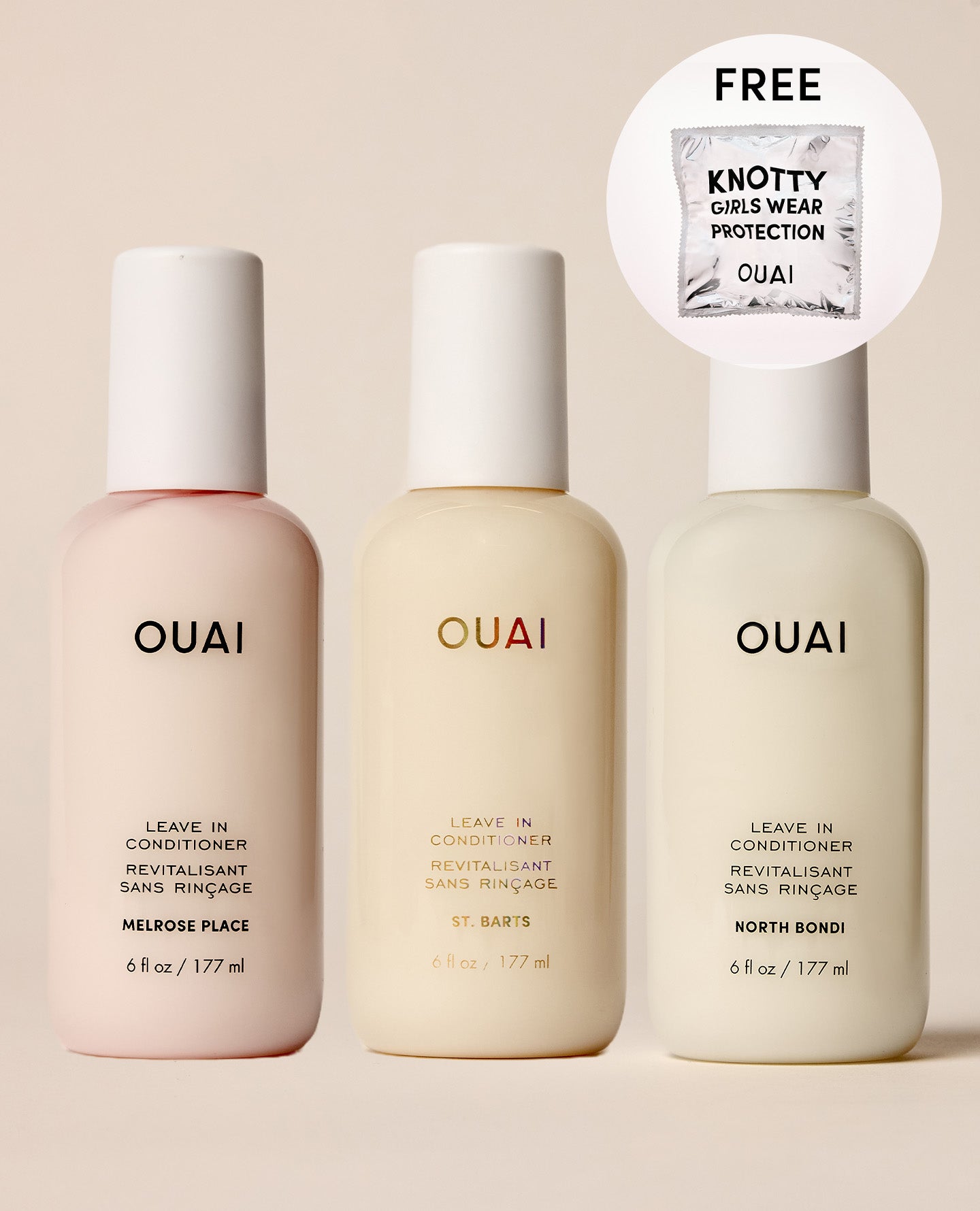 Three OUAI leave-in conditioner bottles in soft pastel shades of pink, cream, and off-white, arranged on a warm beige background. A circular callout in the top right advertises a free knotty gold wear protection packet.