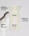OUAI conditioner bottle in off-white with black text, surrounded by white whipped cream and callout lines pointing to ingredients: Kumquat Fruit Extract, Coconut Oil, and Babassu Oil.