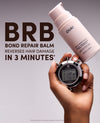 A hand holds a stopwatch and a bottle of OUAI Bond Repair Balm against a gray gradient background with large text reading 'BRB BOND REPAIR BALM REVERSES HAIR DAMAGE IN 3 MINUTES'.