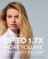 A blonde woman with long, straight hair wearing a white ribbed turtleneck, set against a solid light gray background. Large white text overlays the lower half of the image, reading 'UP TO 1.