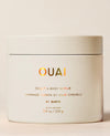 OUAI Scalp & Body Scrub St. Barts 8.8oz white jar on beige background